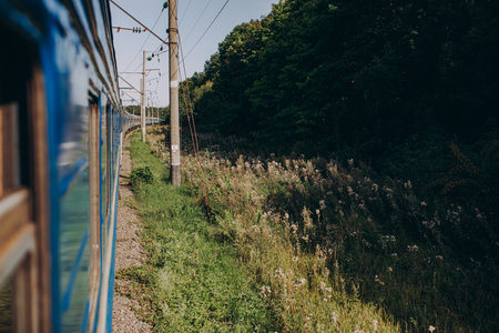 Passenger train moves fast at sunset time. High quality photo