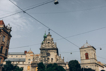 Dome of the church with a cross. City Lviv. Flag of Ukraine. High quality photo