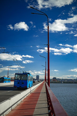 A group of people sitting at a dockの写真素材