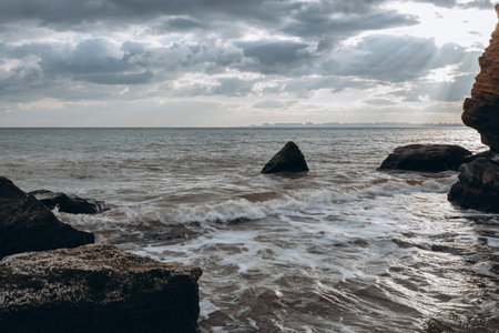 Early morning sunrise over the sea . Some clouds.の写真素材