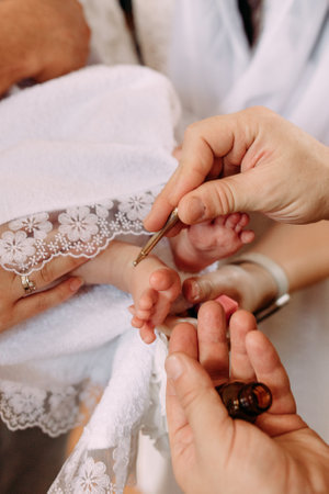 Christening background with baptism baby dress, and cross on pastel backgroundの写真素材