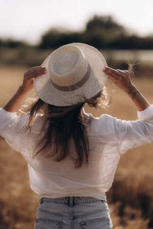 Ripe wheat fields natural landscape at sunset. farm harvest season.の写真素材