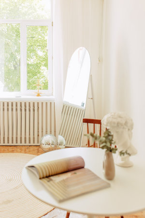 Interior of light living room with sofas, rattan table and soft carpetの写真素材
