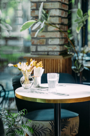 Interior of light living room with sofas, rattan table and soft carpetの写真素材
