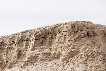 Brown cliff rock formations Textures and patterns backgroundsの写真素材