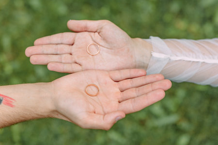 A man removes a wedding ring from his left hand ring fingerの写真素材