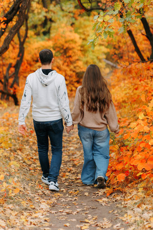 Family Walking Along Autumn Woodland Path Togetherの写真素材