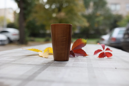 Elegant handmade wood water glass or wooden cup isolated on white background.の写真素材