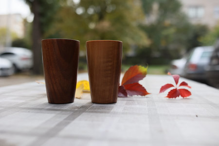 Elegant handmade wood water glass or wooden cup isolated on white background.の写真素材