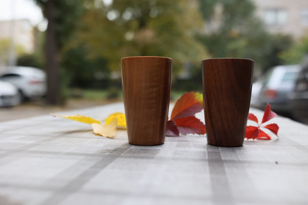 Elegant handmade wood water glass or wooden cup isolated on white background.の写真素材