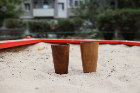 Elegant handmade wood water glass or wooden cup on white background.の写真素材