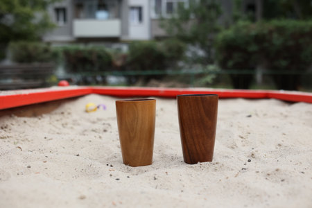Elegant handmade wood water glass or wooden cup isolated on white background.の写真素材