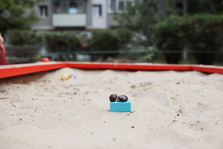Sandbox with various outdoor toys. Sandbox for childrens games. Summer concept.の写真素材