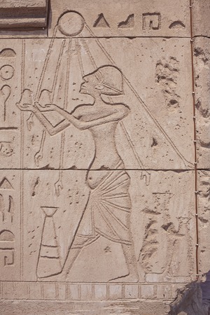 Ancient egyptian paintings on the stone plate