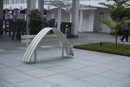 Singapore - 01 November 2014: Modern sculpture of deformed distorted white bench in minimalistic styleのeditorial素材