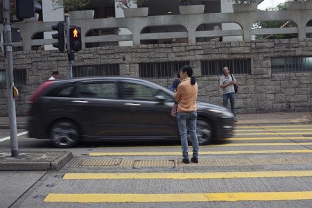 Hong Kong, China - November 12, 2014: Moving activity on busy street scene in cityのeditorial素材