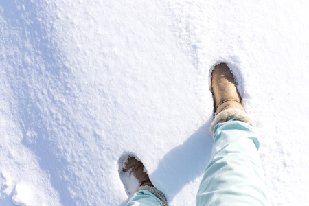 Boots tread on powder snow in Japan
