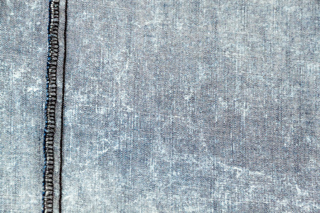 Pale blue denim textile with seamの写真素材