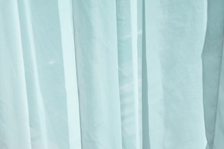 Light green fabric curtain with creaseの写真素材