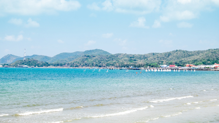 Beach and mountain in sunny day with faraway   windsufing backgroundの写真素材