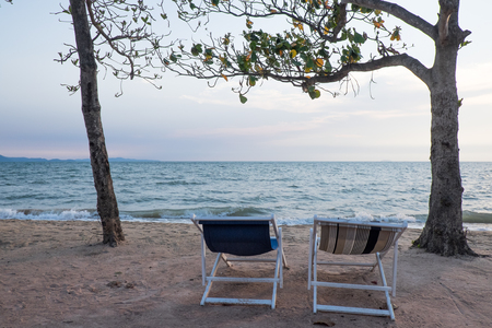Couple beach chairs and sea viewの写真素材