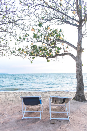 Couple beach chairs and sea viewの写真素材