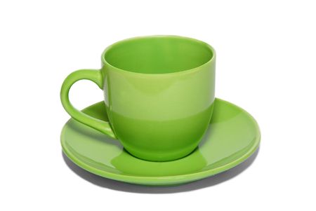 Green ceramic cup and saucer isolated on white.の写真素材