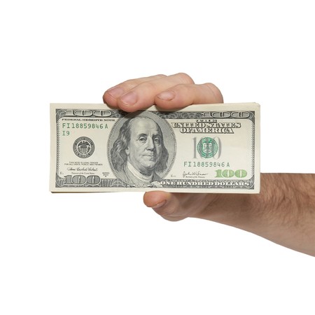 Hand with american dollars isolated on white.