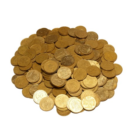 Heap of golden coins isolated on white.の写真素材