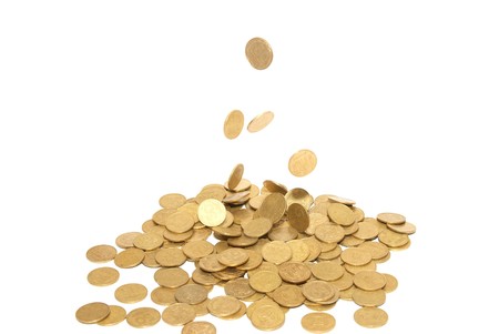 Rain of golden coins isolated on whiteの写真素材