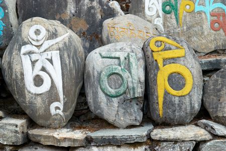 Tibetan colorful prayer stones with letters. Nepal.の写真素材