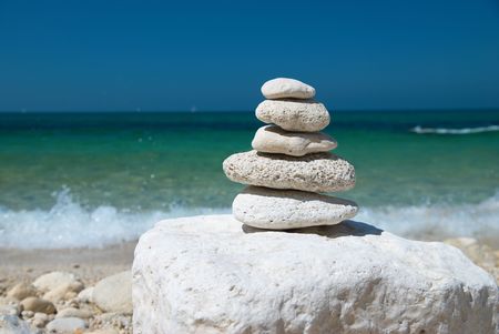 Stone tower with blue sky and sea backgroundの写真素材