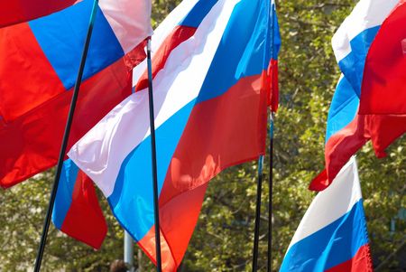 Many russian flags fluttered by the wind.の写真素材