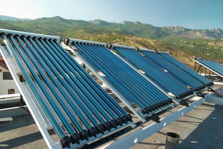 Vacuum solar water heating system on the house roof.の写真素材