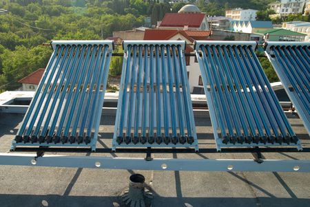 Vacuum solar water heating system on the house roof.の写真素材