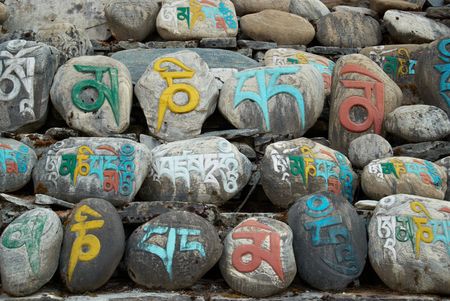 Tibetan colorful prayer stones with letters. Nepal.の写真素材