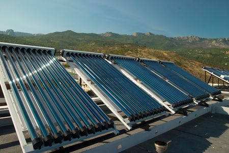 Vacuum solar water heating system on the house roof.の写真素材