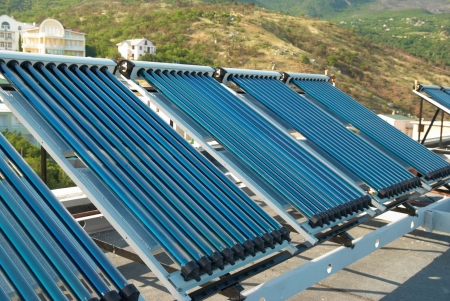 Vacuum solar water heating system on the house roof.の写真素材