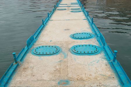 Mooring with hatches and sea.の写真素材
