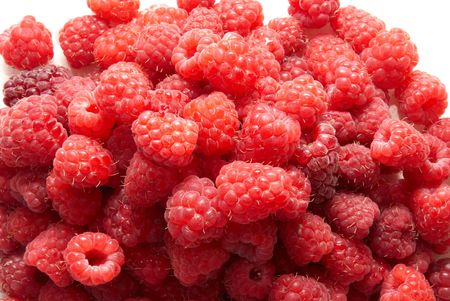 Pile of raspberries isolated on white backgroundの写真素材