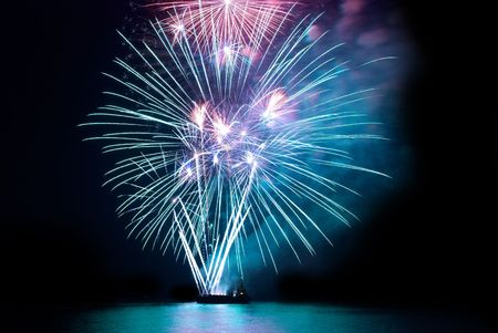 Fireworks, salute with the black sky backgroundの写真素材