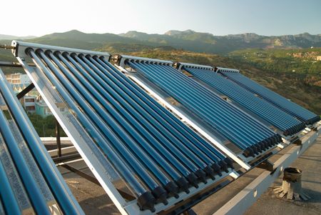 Vacuum solar water heating system on the house roof.の写真素材