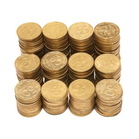 Stack of golden coins isolated on whiteの写真素材