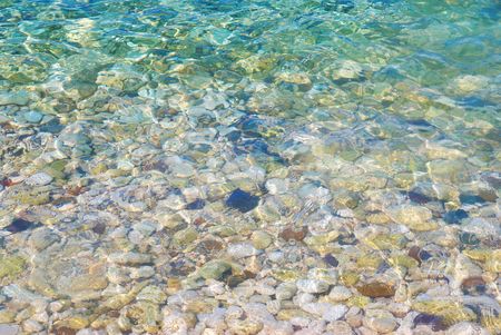 Blue tropical water with a sunlight reflectionsの写真素材