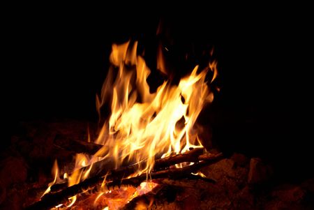 Red bright campfire with the black background