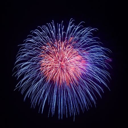 Beautiful fireworks on the black sky backgroundの写真素材