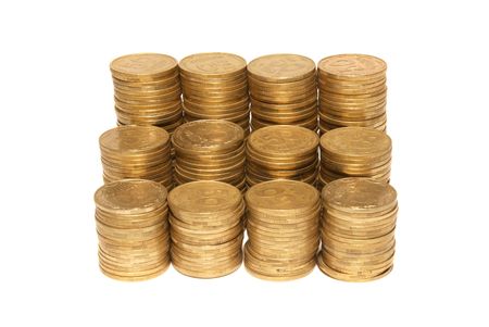 Stack of golden coins isolated on whiteの写真素材