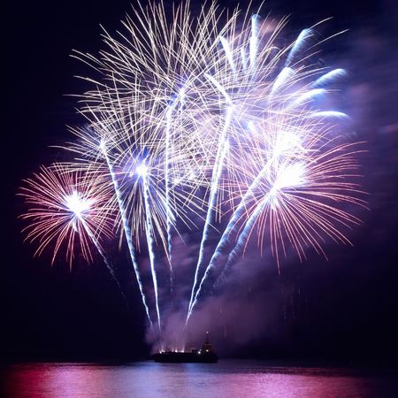 Fireworks, salute with the black sky backgroundの写真素材