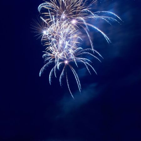 Fireworks, salute with the black sky backgroundの写真素材