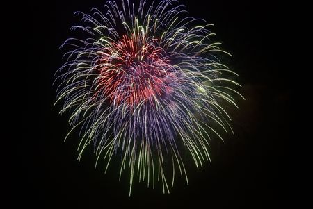 Beautiful fireworks on the black sky backgroundの写真素材